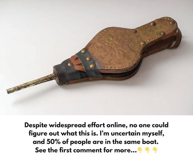 A classic vintage fireplace bellows with a beautifully embossed floral design, adding charm to any hearth.