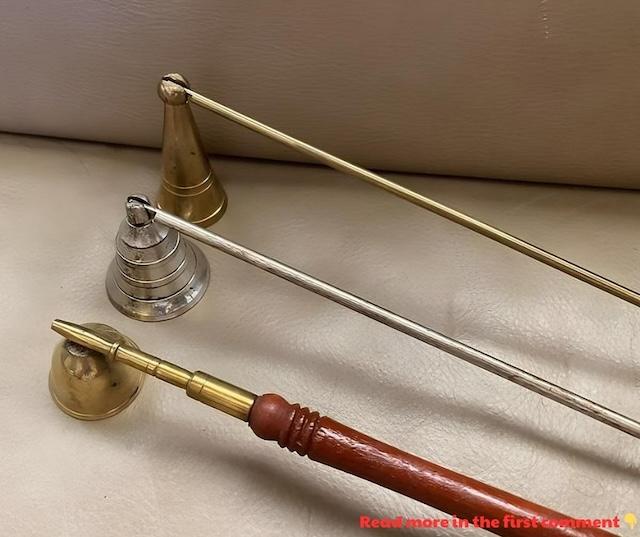 A classic brass vintage candle snuffer with an intricately designed handle, used to extinguish candles without blowing them out.